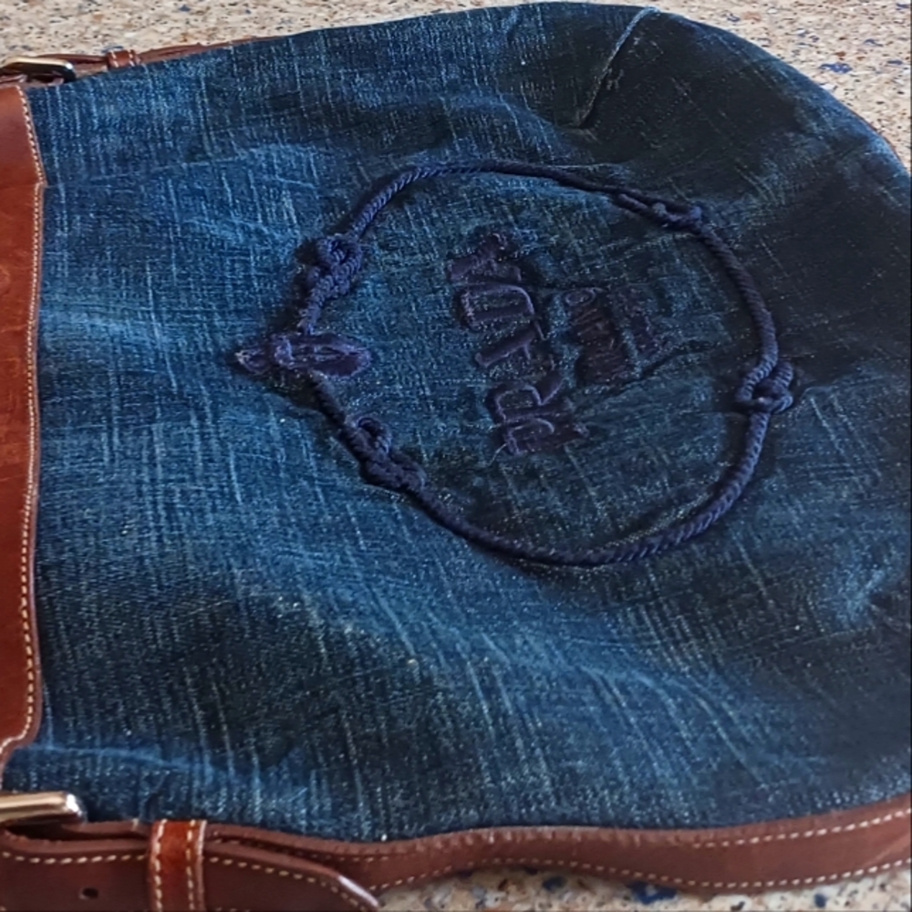 Prada logo ,Denim ,navy blue leather strap and edging. Snap closure